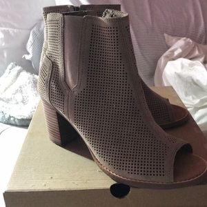 Gently worn suede perforated ankle booties
